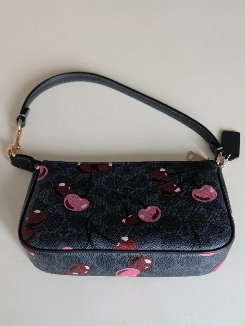 Coach Black Cherry Print Wristlet with Pink Accents